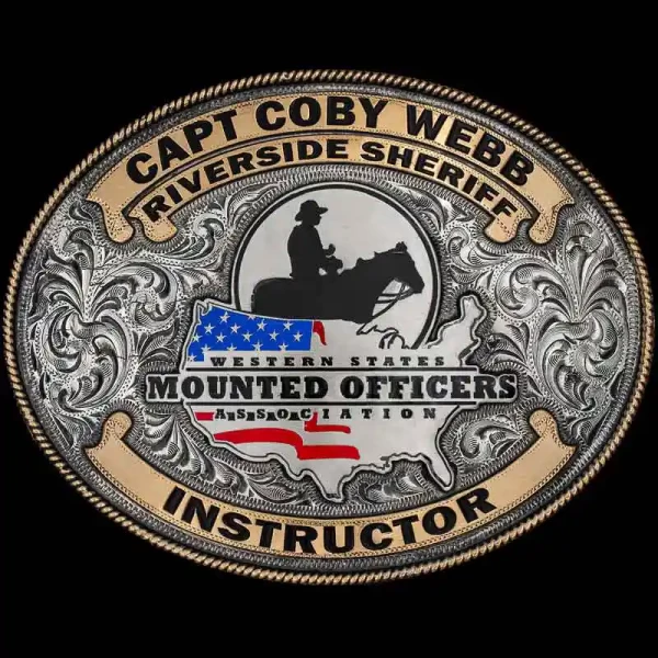 "Our ___ Buckle is designed to honor those who led with authority and skill. This Buckle is crafted on a hand-engraved, German Silver base with our signature antique finish. The Jeweler's Bronze rope edge and banners add to the classic cowboy style o